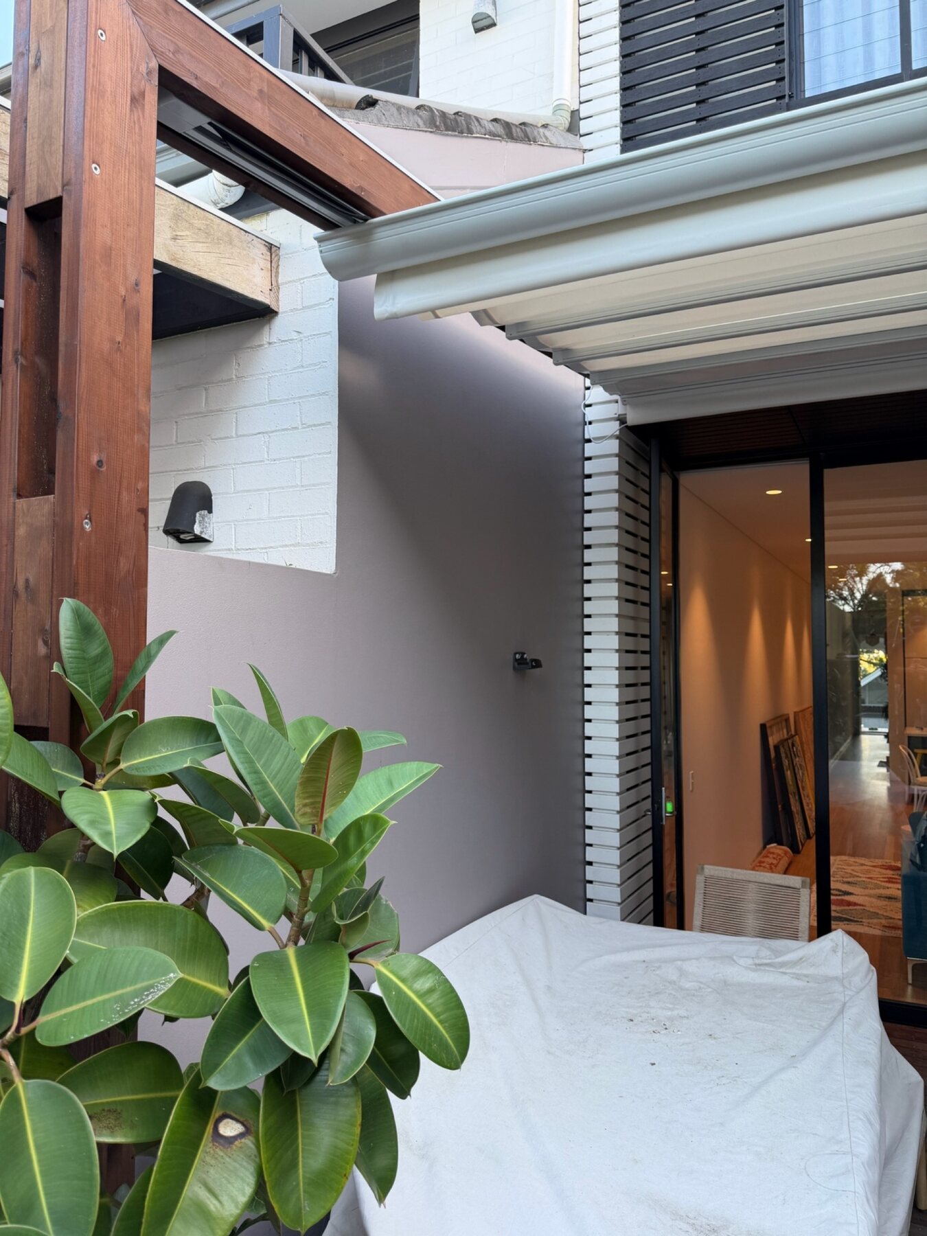 Roof stacked away above a compact courtyard